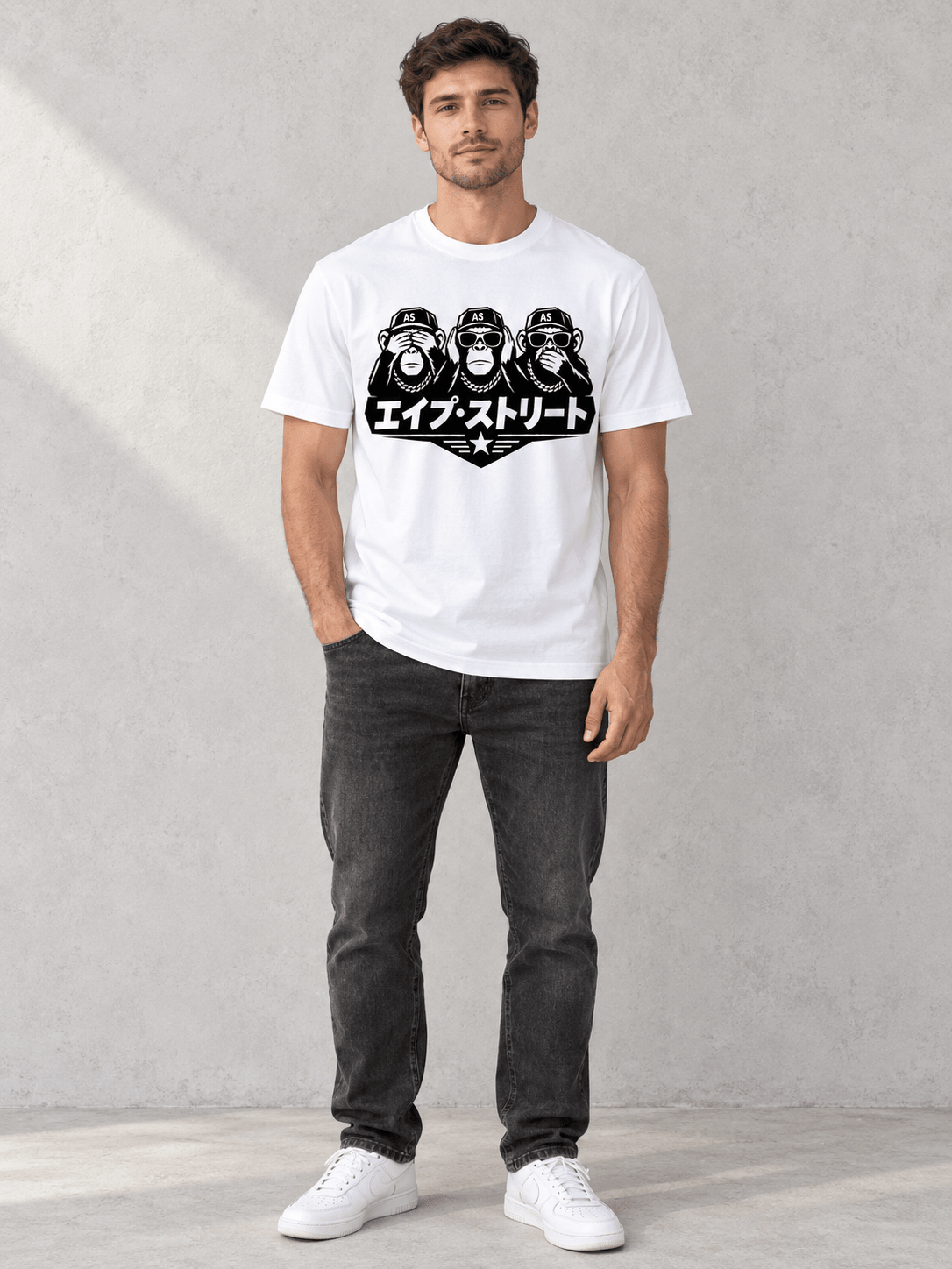 Model wearing Ape Street No Evil Japanese Tee, front view showing the design, against a light concrete backdrop.