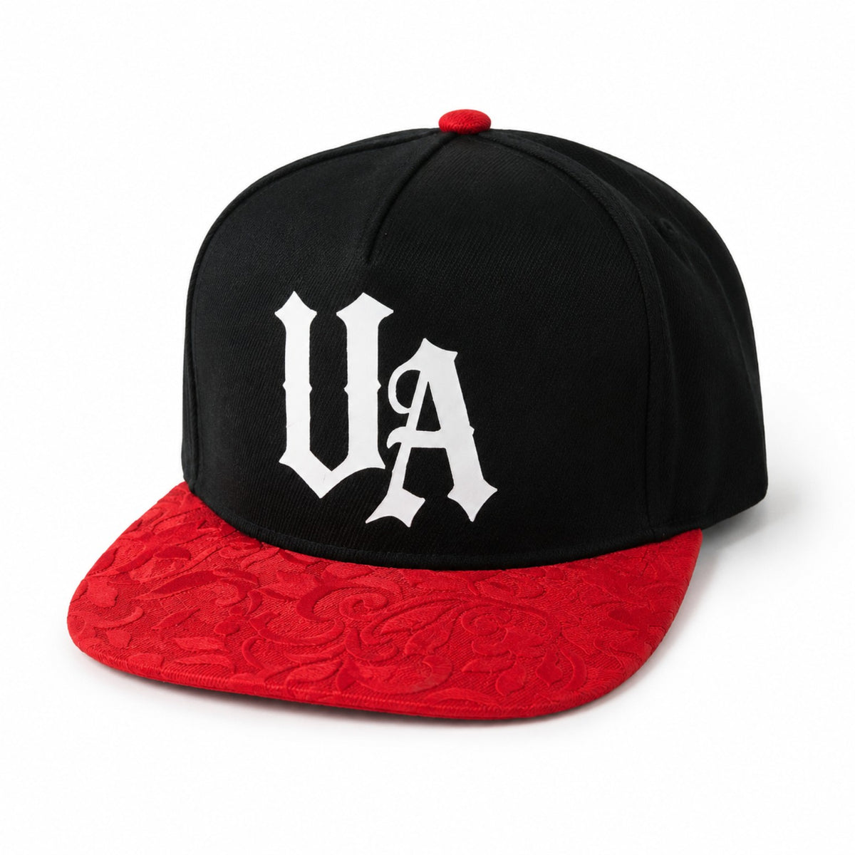 Urban Avenue black cap with white UA logo and red patterned flat peak, front view.