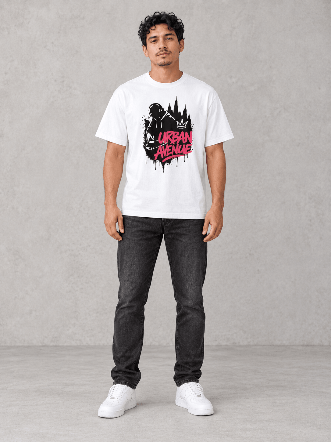Model wearing Urban Avenue City Beats Tee, front view showing the design, against a light concrete backdrop.