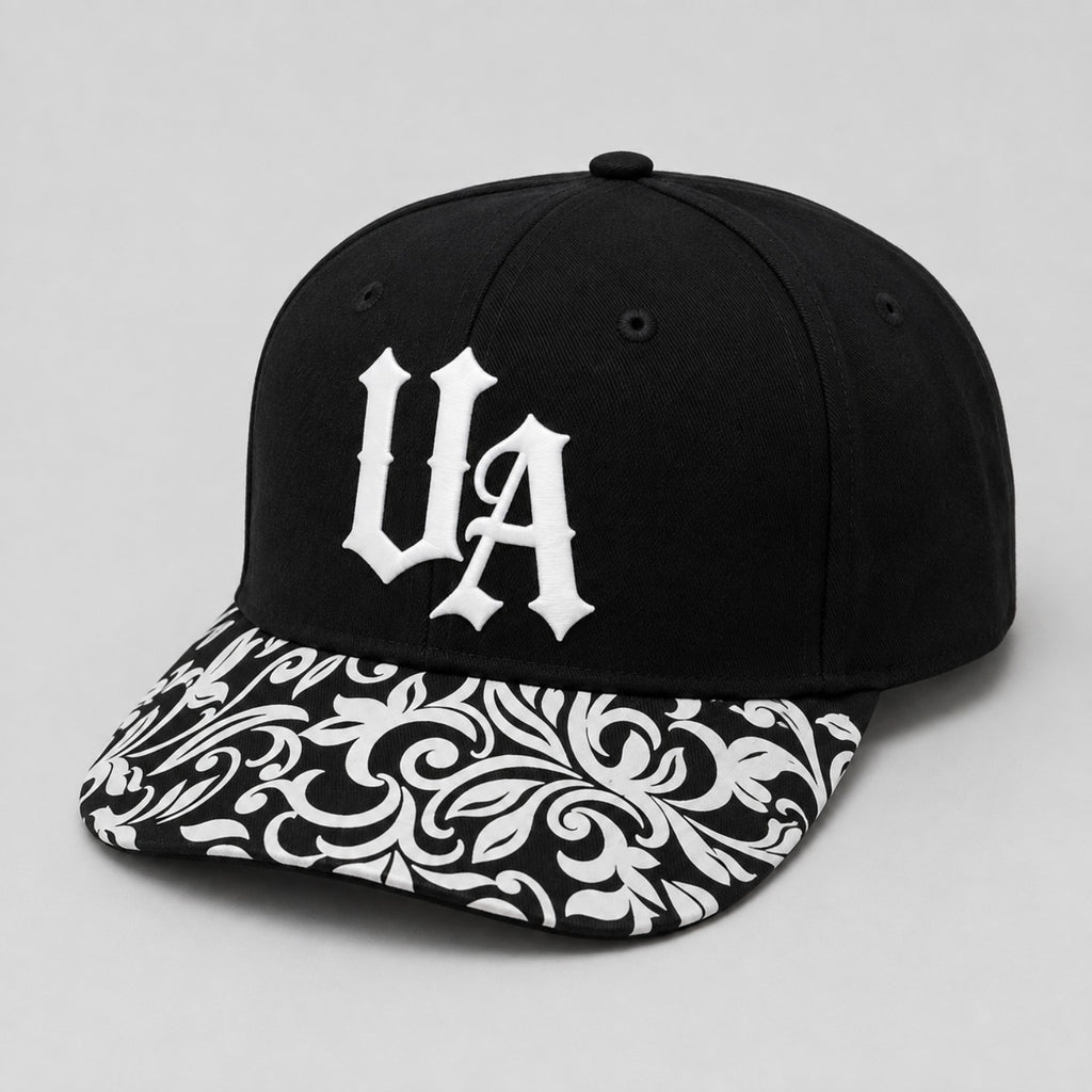 Urban Avenue UA baseball cap in black and white, front view.