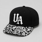 Urban Avenue UA baseball cap in black and white, front view.