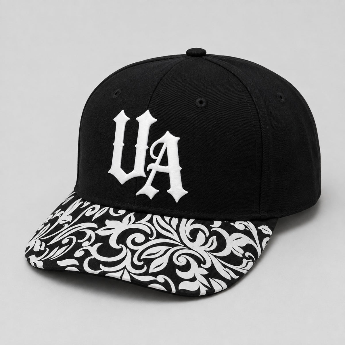 Urban Avenue UA baseball cap in black and white, front view.