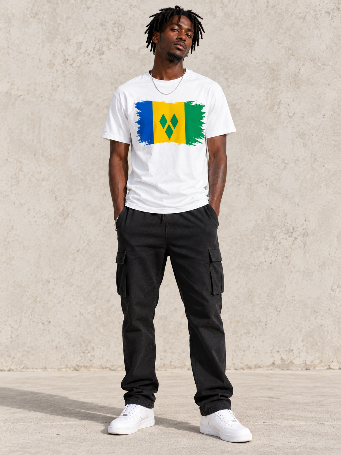 Model wearing the white Wear Your Flag Caribbean full-length tee with Saint Vincent and the Grenadines flag graphic.